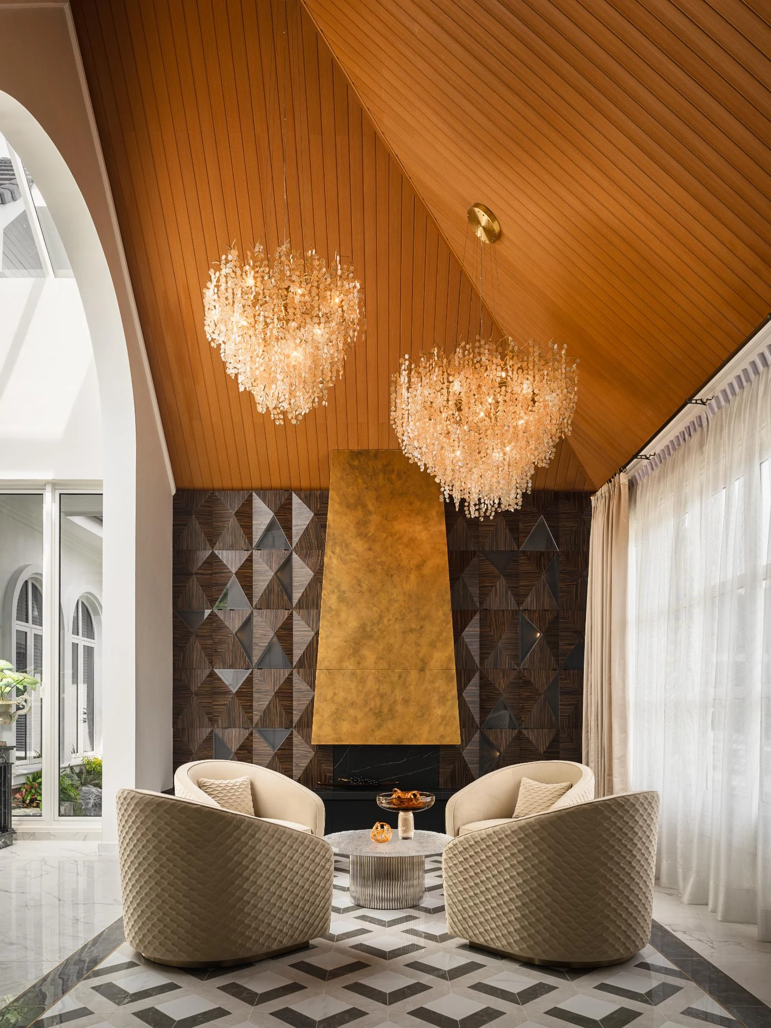 Angled brass fireplace and timber ceiling at House on the Peak