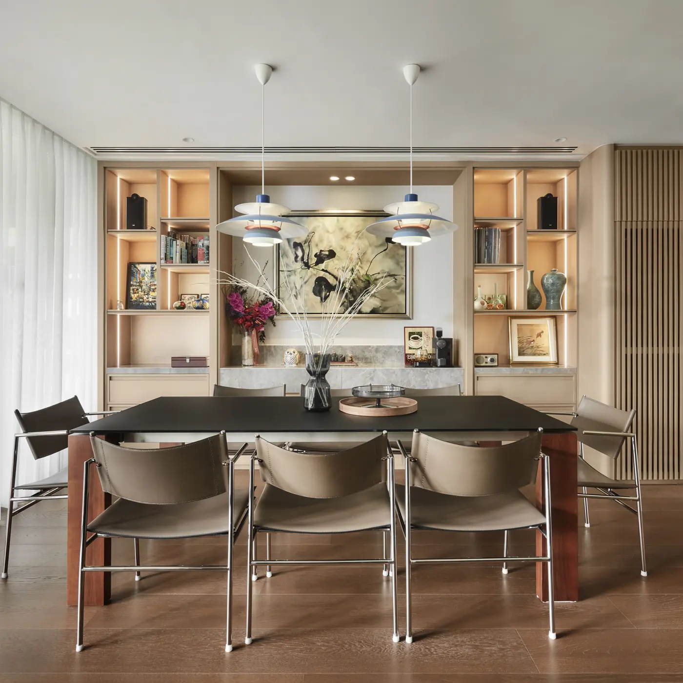 Dining area with PH 5 pendants and bespoke display wall