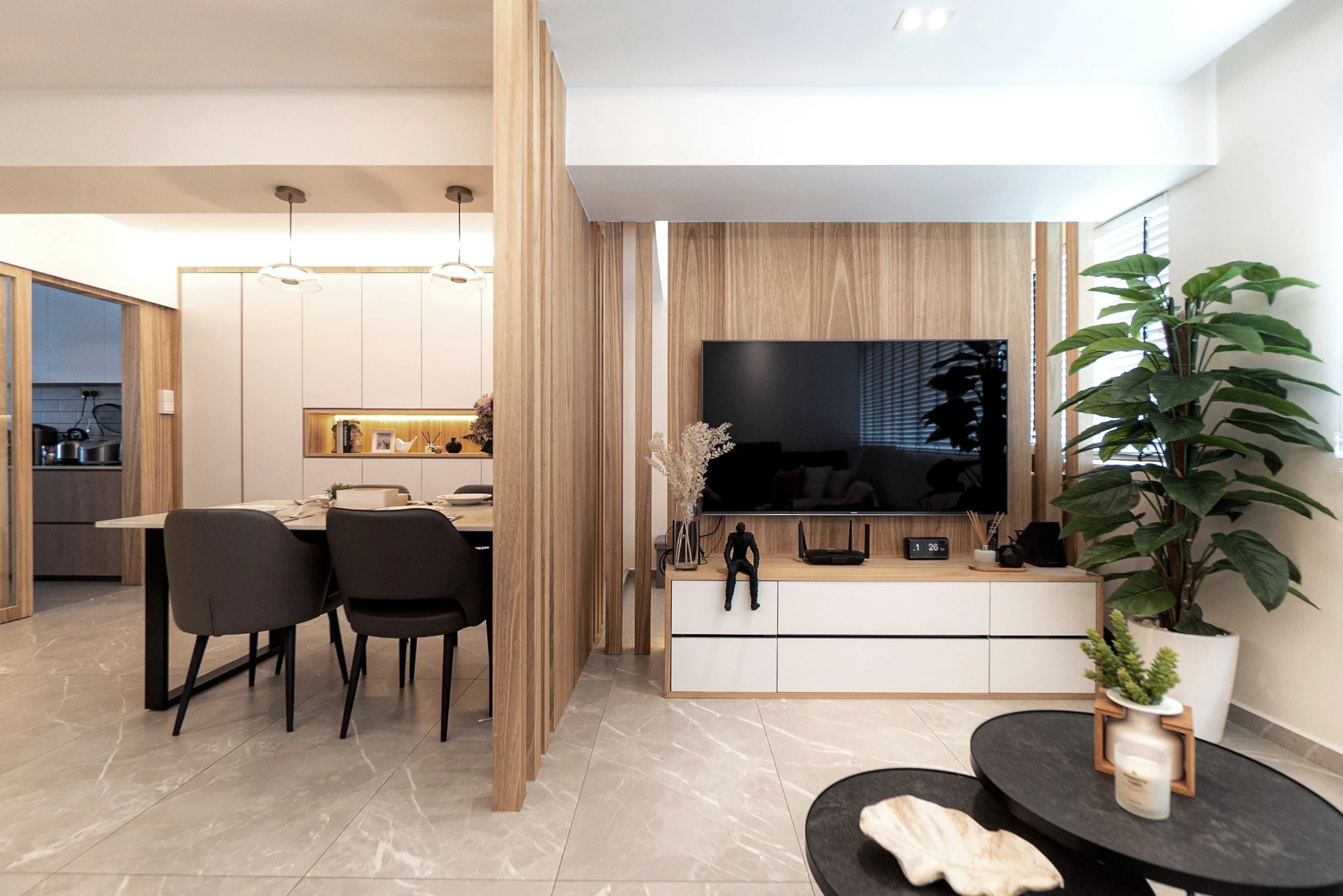 J Concept Designers Bishan HDB living area with natural wood veneer TV wall, low white cabinetry and vertical timber slats