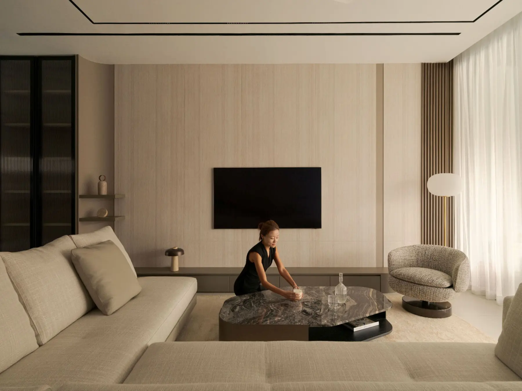 Living room — full width with TV wall, sofa, lounge chair and sheer curtains