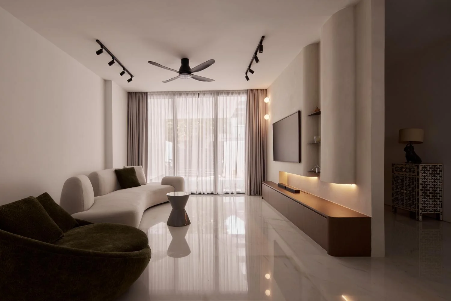 Spacious living room with long television wall