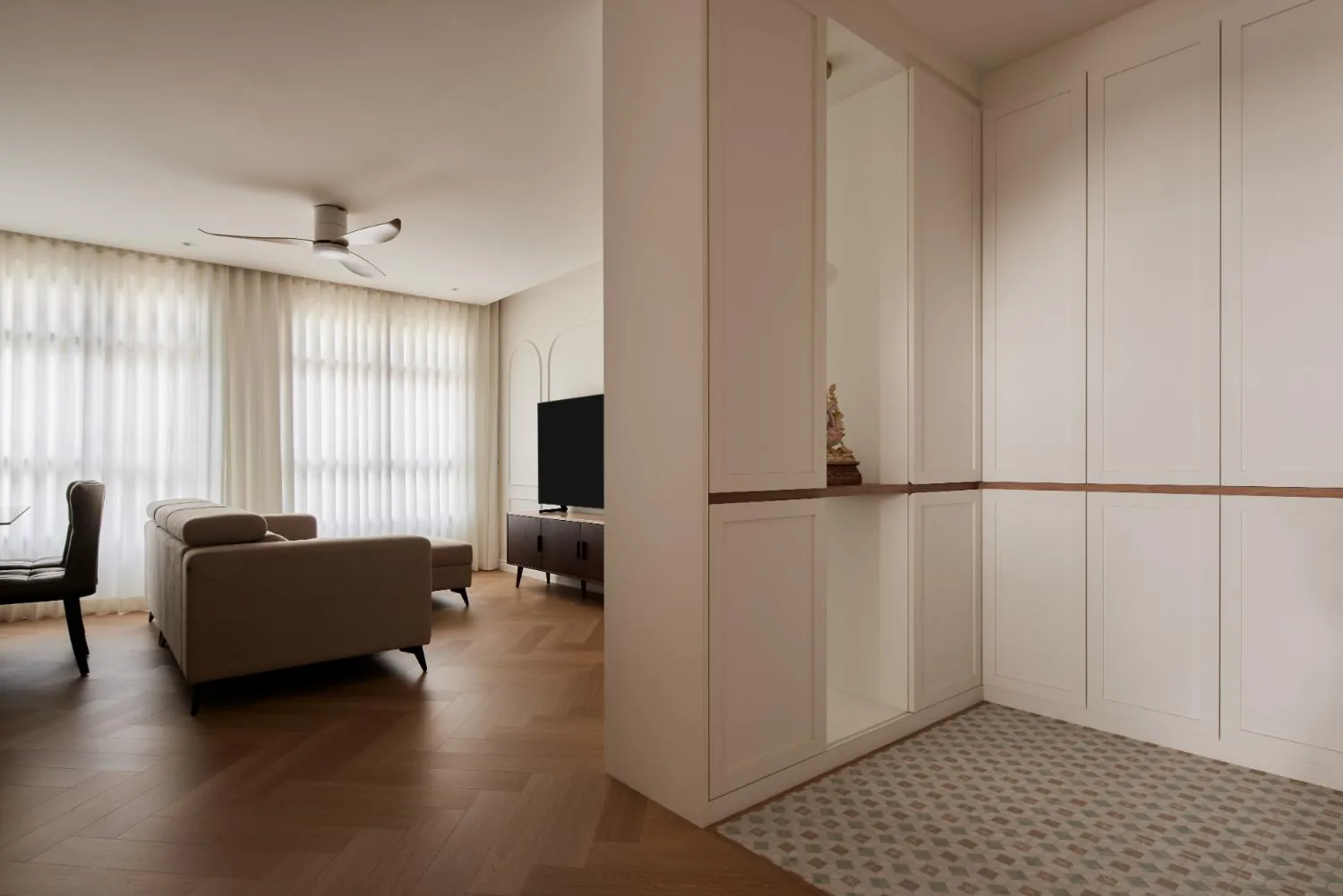 Foyer with concealed storage and patterned floor tiles