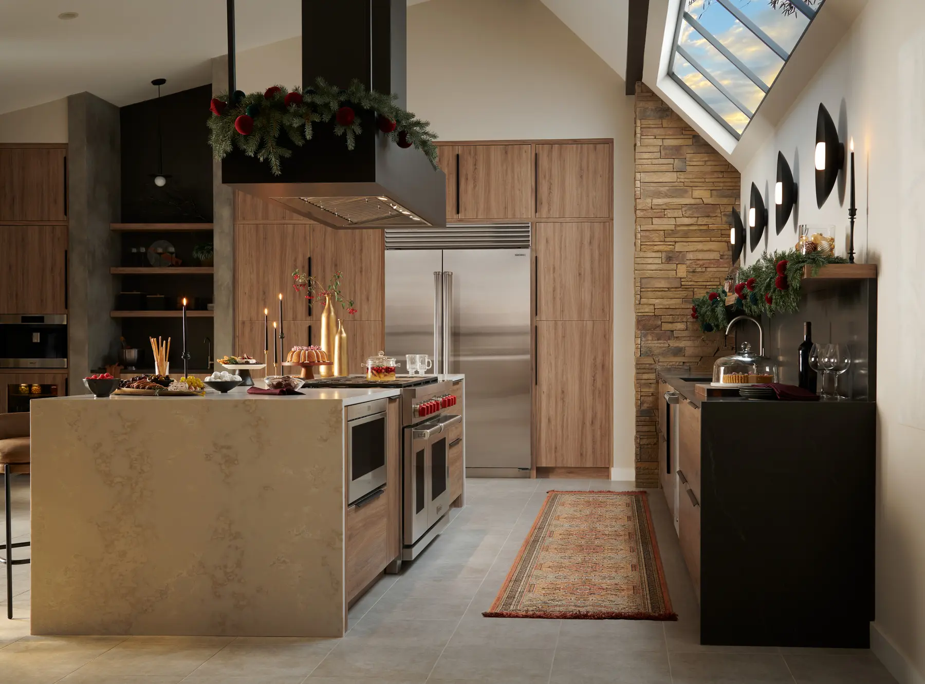 Sub-Zero refrigeration and Wolf cooking appliances integrated into a warm contemporary kitchen