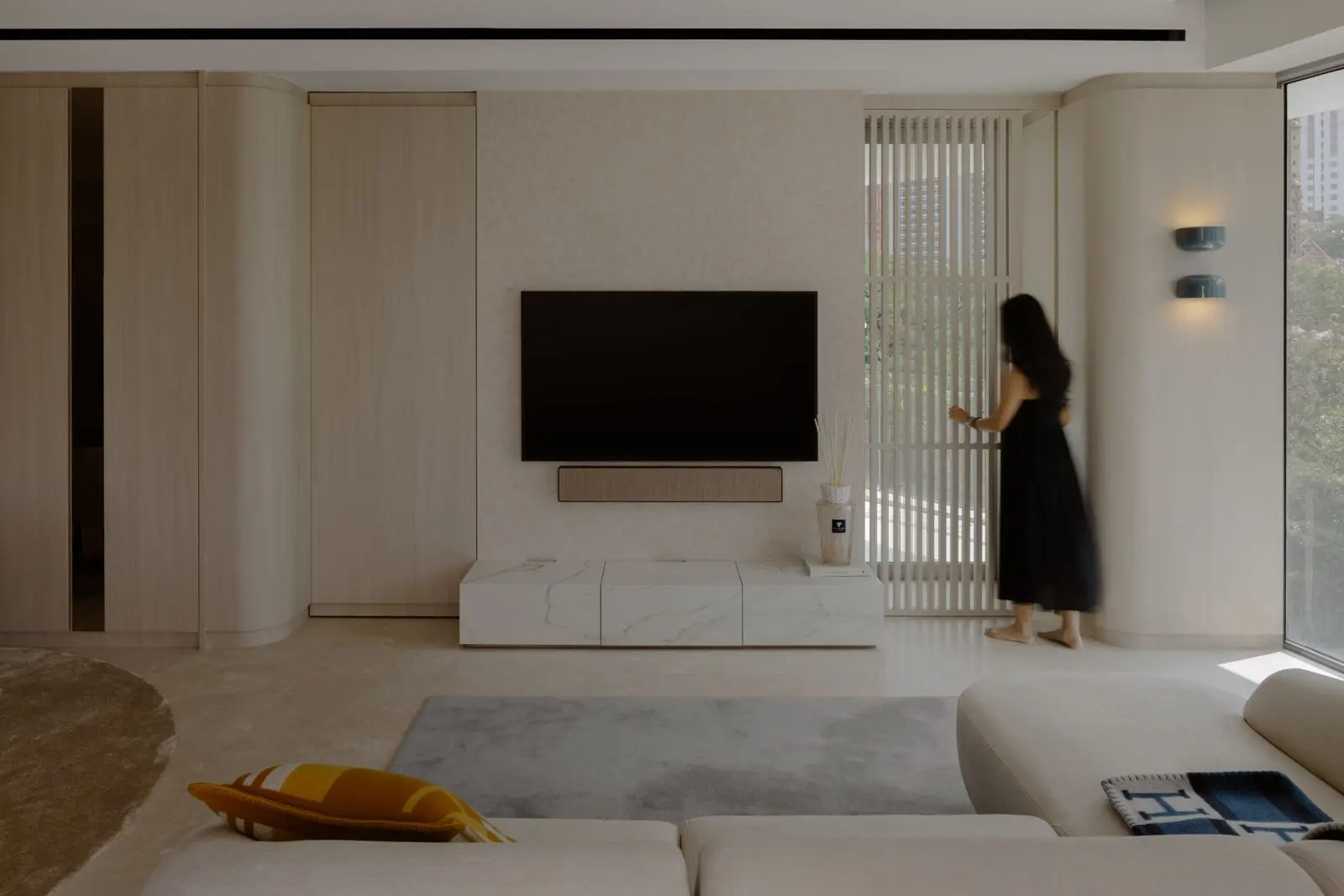 Living room television wall with integrated concealed storage